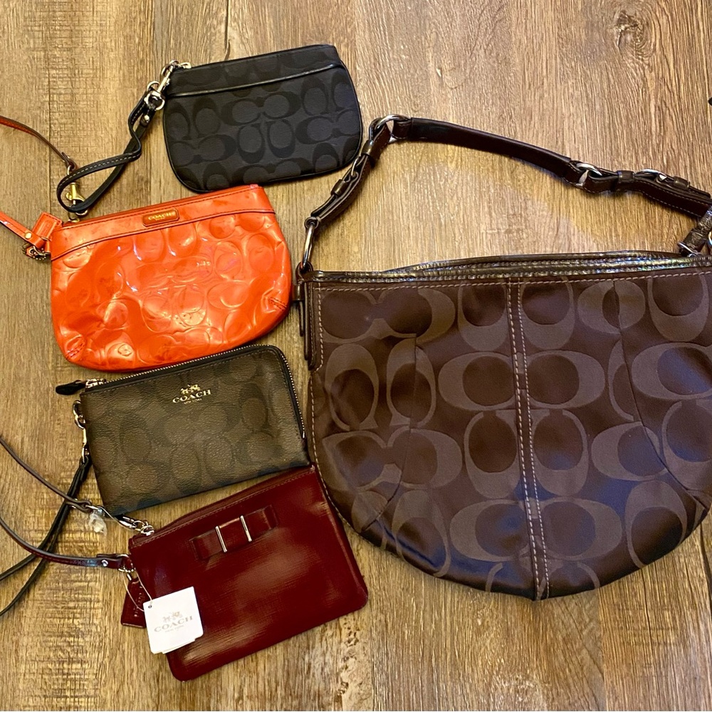 Coach set with brown shoulder purse and black, brown, red and orange wristlets